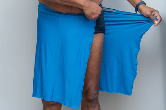 Male standing with Wrap on but unsnapped so viewer can see how it snaps and stretches